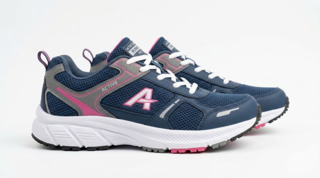 Side view of budget women’s jogging shoes showing EVA foam midsole and rubber outsole on a white background